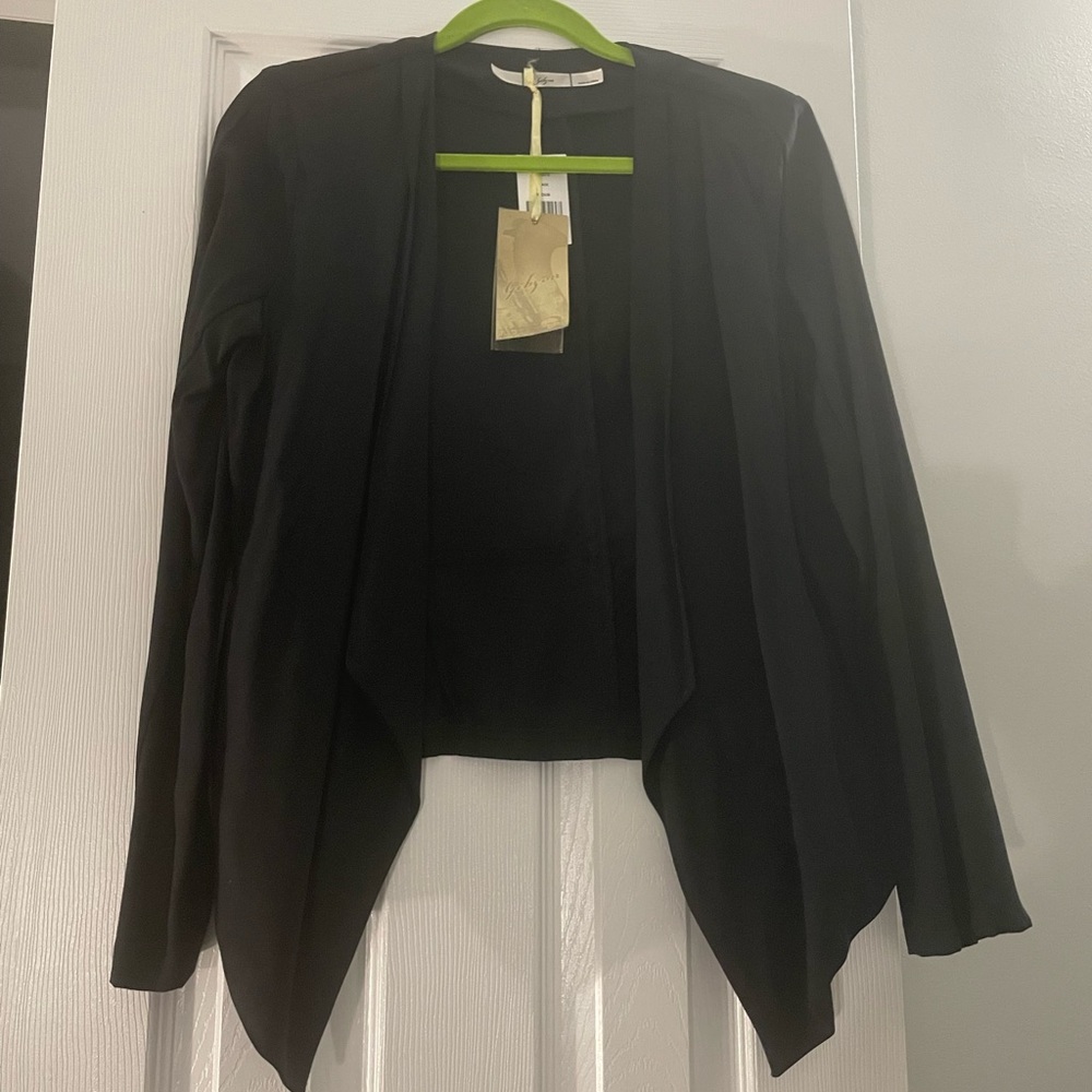 Women’s black open front cardigan in black. Size medium. New with tags.